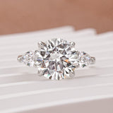 Moissanite 4.0 Ct Round Cut White Gold Engagement Ring with Pear Cut Side Stone